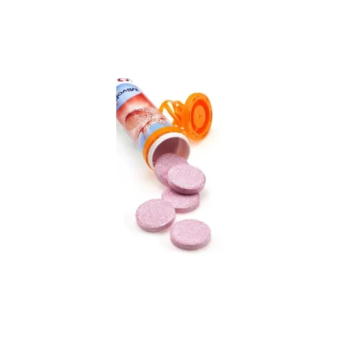 Comprimés effervescents roses Mivolis Vitamine C sortant d'un tube orange et bleu.